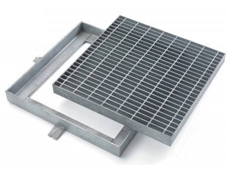 A square gully and well cover made of steel grating.