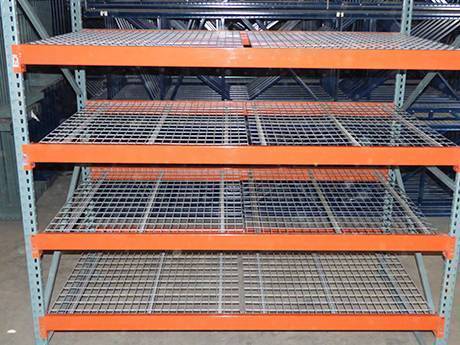 Four layers of galvanized surface treated orange medium size steel grating shelf.