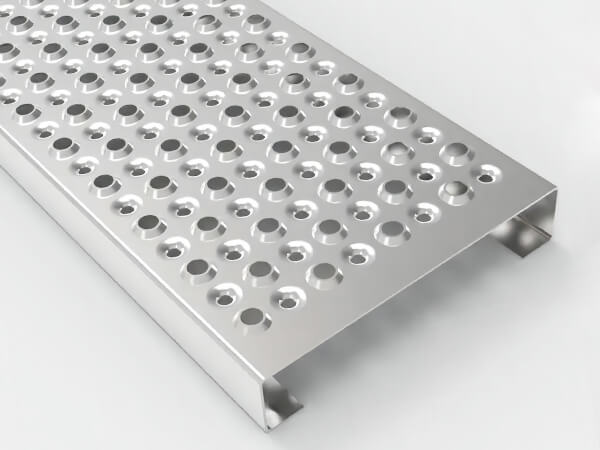 A piece of perforated steel grating on gray background.