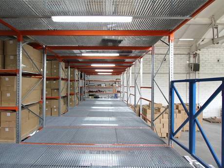 Platform grating as floor in a warehouse.