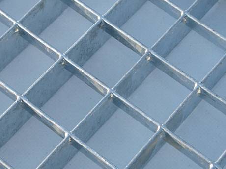 A press-locked steel grating with large mesh size.