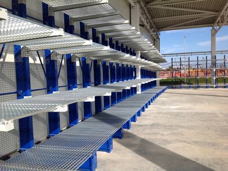 In a wide field, press-locked steel grating p used as shelf.