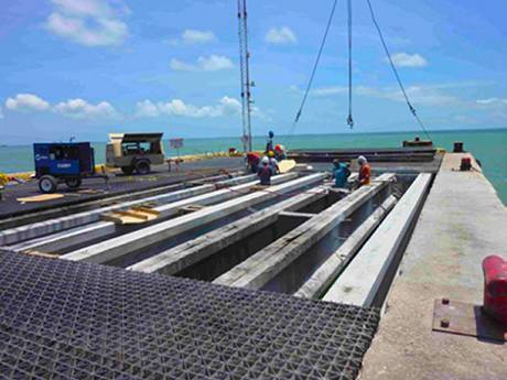 This is a pier that several workers are working.