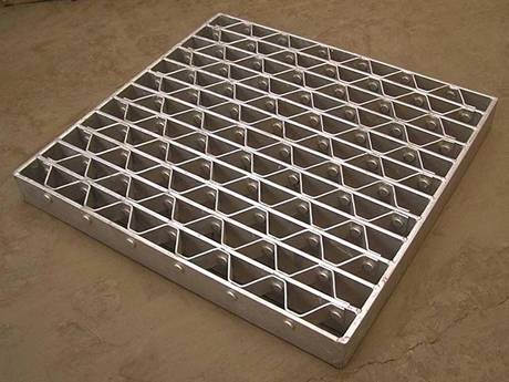 This is a well cover made of riveted grating.