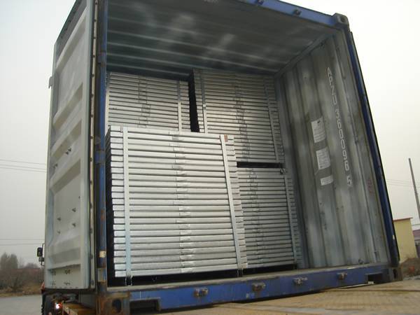 Several pallets of standard steel gratings in the container.