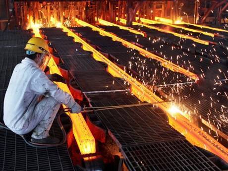 Steel grating pathway near steel that is being processing.