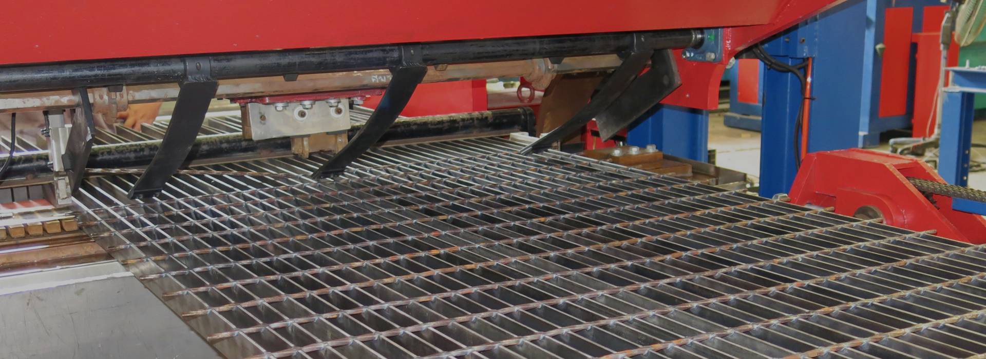 A machine is producing steel grating.