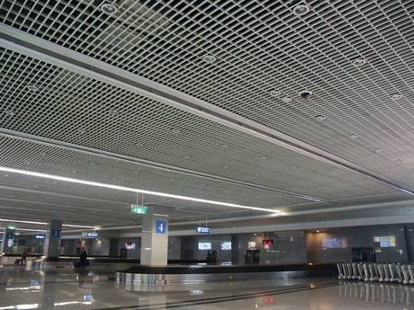 Steel grating suspend ceiling in the luggage hall at the airport.