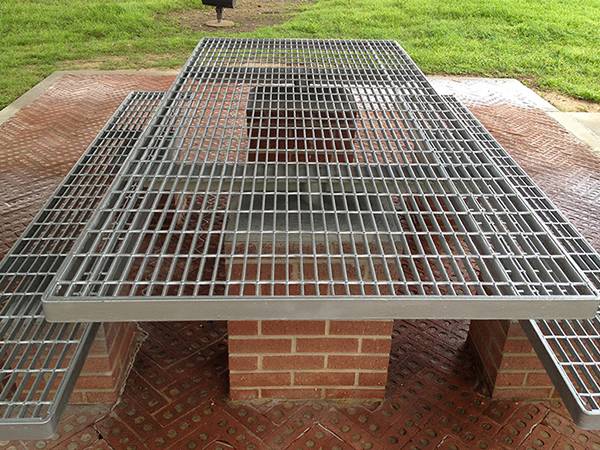 Welded steel gratings are served as desk and seats in the park.